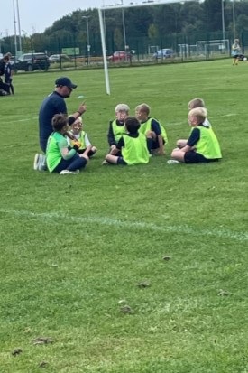 Peter coaches his son's under 9s football team